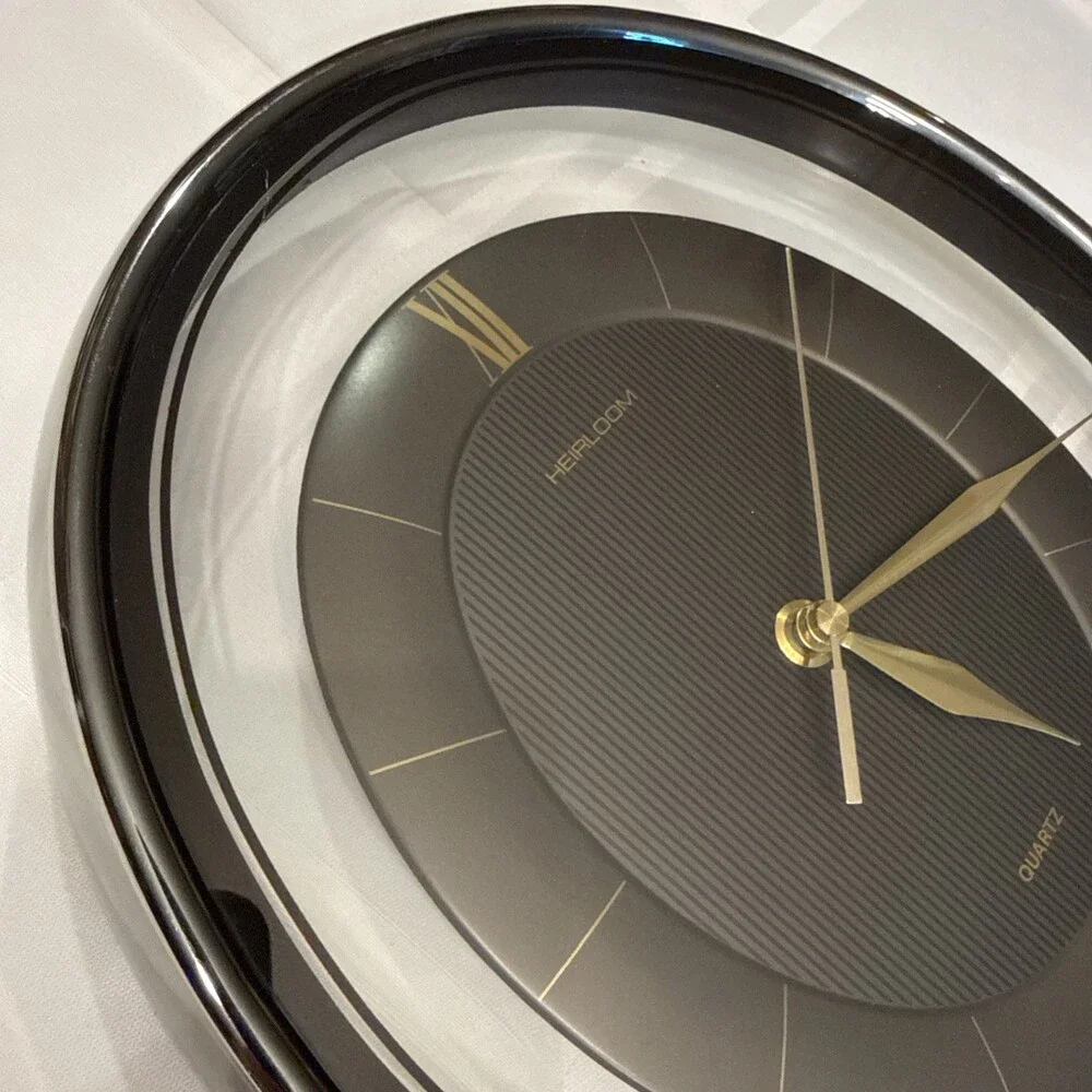 Vintage 1980s Heirloom Quartz Wall Clock Clear Lucite Floating Oval Black Gold